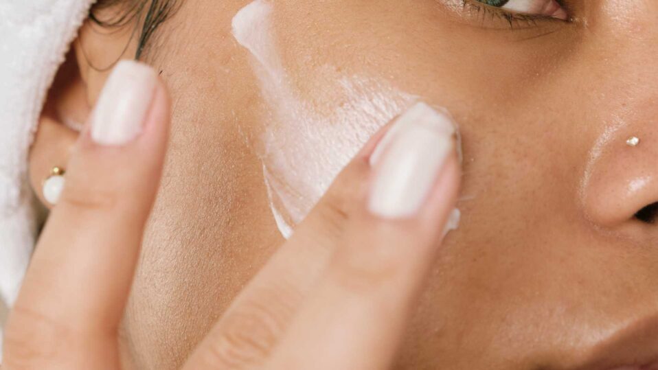 woman applying cream